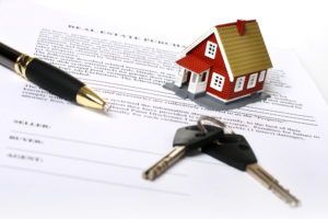 Estate Lawyer Lackawanna County, PA - Real estate concept. Keys, money, small house and contract over white.